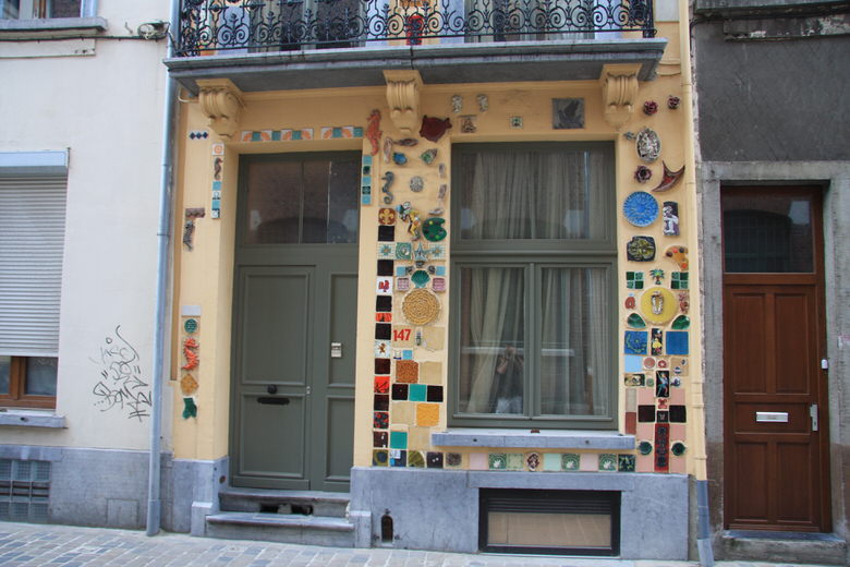 Photos of the house displaying the ceramic art facade