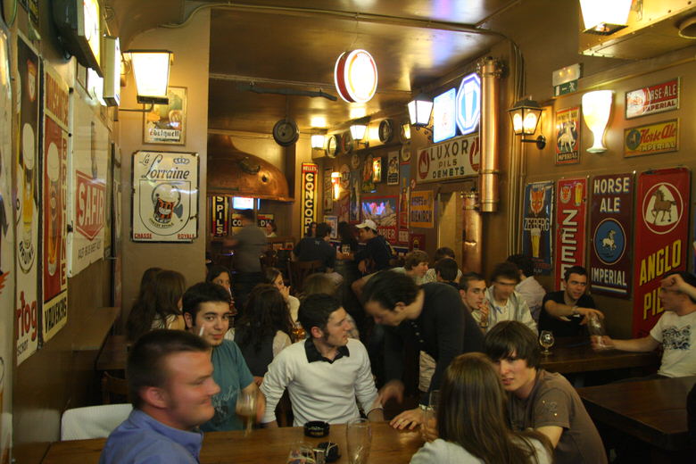 In the back just next to the stairs that lead downstairs of Delirium cafe brussels