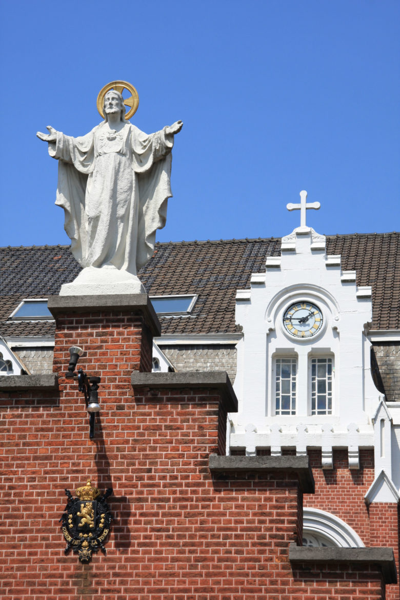 Jesus statue on Institut Royal pour Sourds Muets et Aveugles de Woluwe-Saint-Lambert