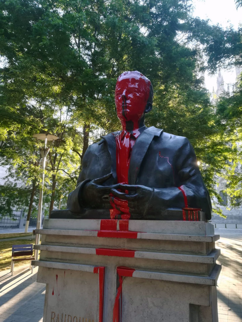 Red paint covers the statue of King Baudouin in Brussels