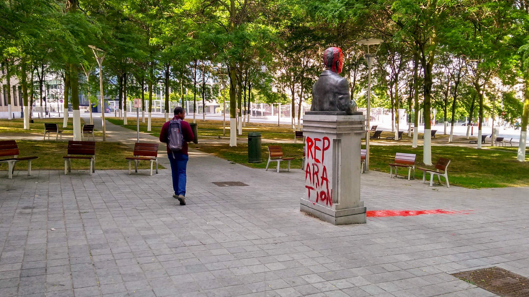 King Baudouin statue tagged with the words REPARATIONS